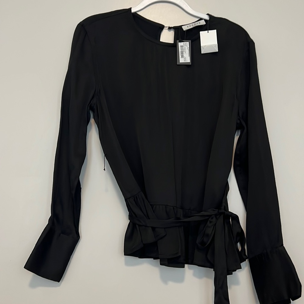 Sandro black blouse with optional belt.